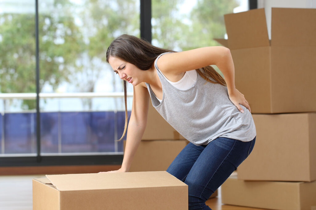 woman with poor body mechanics having back pains