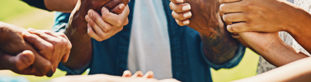 friends holding hands in support